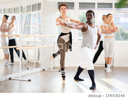 Adult man and adult woman rehearsing pair ballet 139316148