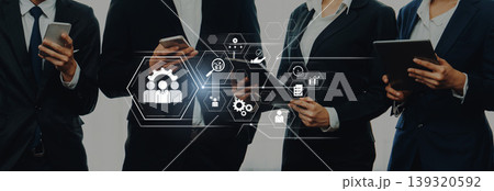 Business Professionals Using Technology for Team Collaboration and Strategy Development, Focus on Communication Icons and Digital Interaction Tools Trope Business Professionals Using Technology for Team Collaboration and Strategy Development, Focus on Communication Icons and Digital Interaction Tools Trope 139320592