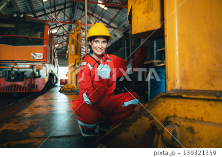 Worker smiles confidently in industrial setting Worker smiles confidently in industrial setting 139321359