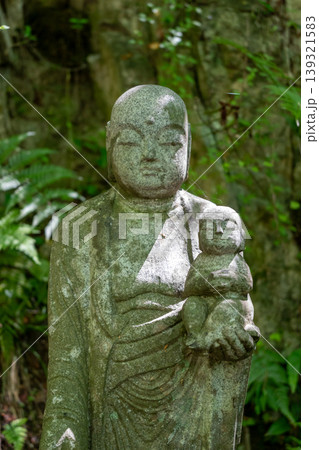 Jizo Bosatsu statue holding baby at Mitaki-Dera in Hiroshima 139321583