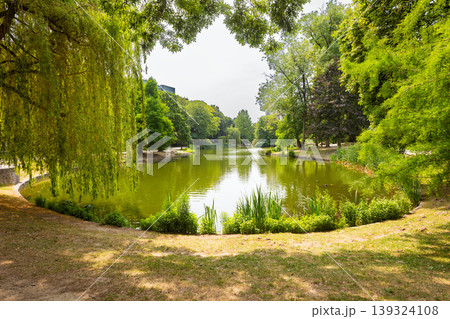 Scenic pond with green trees in Leopold Park in Brussels, Belgium Scenic pond with green trees in Leopold Park in Brussels, Belgium 139324108
