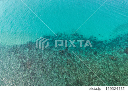 Aerial view of coral reefs and clear turquoise sea water in the Eastern Sea of Thailand. Aerial view of coral reefs and clear turquoise sea water in the Eastern Sea of Thailand. 139324385