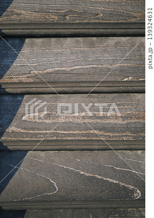 Close up texture of horizontal wooden louvers creating a clean, neutral surface suitable for design and layout use. 139324631