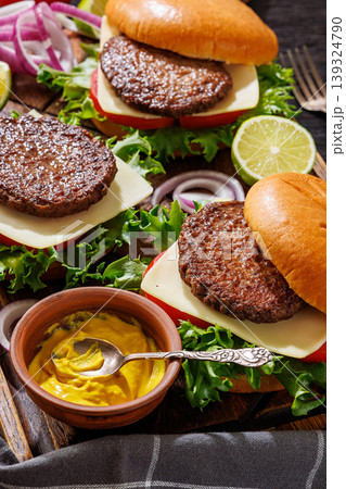 beef cheeseburgers with brioche buns on a tray 139324790