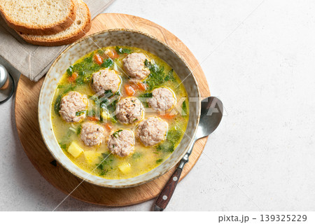 Homemade meatball soup 139325229
