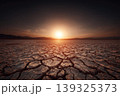 endless drought crack ground with sunburst under cloudy sky 139325373