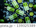 Green lime popsicles with fresh mint and ice cubes on bed of crushed ice. 139325389