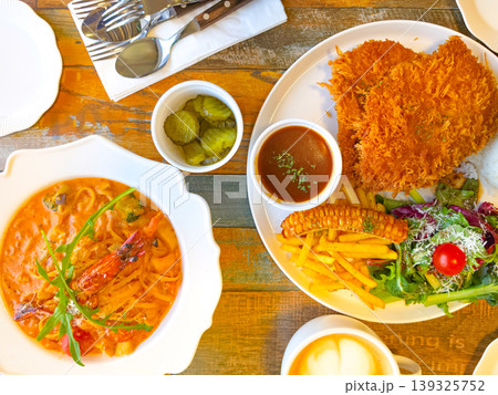 Spaghetti with shrimp and olive oil with garlic sauce. Asian food Pork cutlet Spaghetti with shrimp and olive oil with garlic sauce. Asian food Pork cutlet 139325752