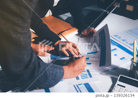 Professional photo of a person's hands reviewing a contract or legal document on a desk, for concepts of business, finance, and legal affairs Professional photo of a person's hands reviewing a contract or legal document on a desk, for concepts of business, finance, and legal affairs 139326134