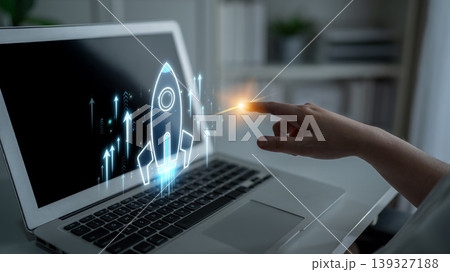 A modern laptop displays a rocket launch graphic, symbolizing digital growth and entrepreneurship. The image captures innovation and technology in business environments. Sigmoid 139327188