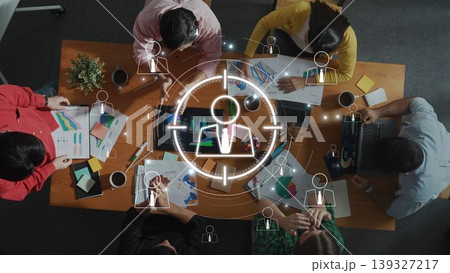 Collaborative Business Meeting with Diverse Team Analyzing Graphs and Charts in Modern Office Space with Target Icon Overlay. Raster Collaborative Business Meeting with Diverse Team Analyzing Graphs and Charts in Modern Office Space with Target Icon Overlay. Raster 139327217