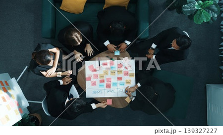 Top view of people putting hands together while using mind map. Directorate. Top view of people putting hands together while using mind map. Directorate. 139327227