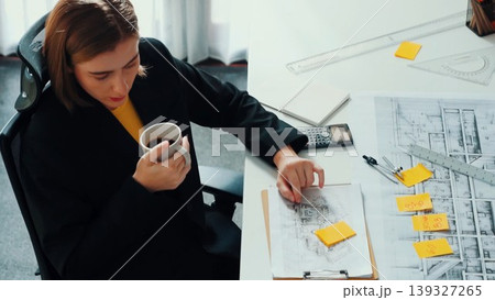 Top view of architect engineer drink coffee and drawing blueprint. Alimentation. 139327265