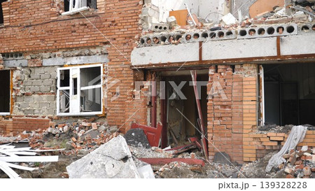 View to destroyed residential buildings at Kharkivska oblast. Ruined houses after bomb attacks on ukrainian territory from russia army. Consequences of russian invasion of Ukraine. Slow motion View to destroyed residential buildings at Kharkivska oblast. Ruined houses after bomb attacks on ukrainian territory from russia army. Consequences of russian invasion of Ukraine. Slow motion 139328228