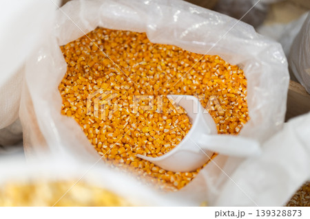 Large bag of dry corn for sale in grocery store 139328873