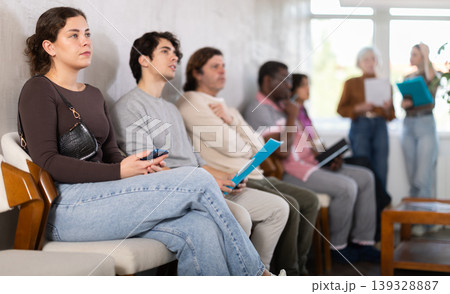 People are sitting in line and waiting for an interview People are sitting in line and waiting for an interview 139328887