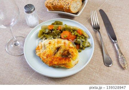Fried cod fish garnished with vegetable ragout Fried cod fish garnished with vegetable ragout 139328947