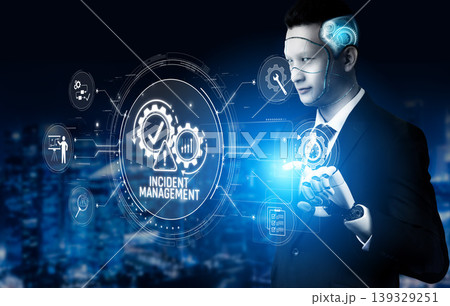 A businessman engages with advanced technology for incident management, showcasing data visualization in a modern urban setting, highlighting innovation and efficiency. Sigmoid 139329251