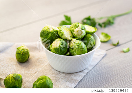 healthy organic brussels sprouts with parsley leaves on wooden table 139329455