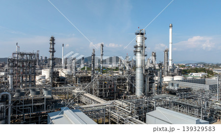 Oil storage tank with oil refinery plant background, Global business power and energy chemical barrel, Oil refinery factory oil storage tank, Petrochemical industrial with blue sky. 139329583