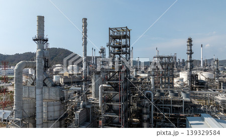 Oil storage tank with oil refinery plant background, Global business power and energy chemical barrel, Oil refinery factory oil storage tank, Petrochemical industrial with blue sky. Oil storage tank with oil refinery plant background, Global business power and energy chemical barrel, Oil refinery factory oil storage tank, Petrochemical industrial with blue sky. 139329584
