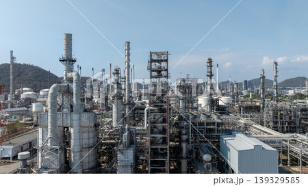 Oil storage tank with oil refinery plant background, Global business power and energy chemical barrel, Oil refinery factory oil storage tank, Petrochemical industrial with blue sky. Oil storage tank with oil refinery plant background, Global business power and energy chemical barrel, Oil refinery factory oil storage tank, Petrochemical industrial with blue sky. 139329585