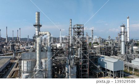 Oil storage tank with oil refinery plant background, Global business power and energy chemical barrel, Oil refinery factory oil storage tank, Petrochemical industrial with blue sky. Oil storage tank with oil refinery plant background, Global business power and energy chemical barrel, Oil refinery factory oil storage tank, Petrochemical industrial with blue sky. 139329586
