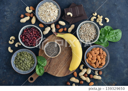 Top view of magnesium rich foods arranged on a dark background Top view of magnesium rich foods arranged on a dark background 139329650
