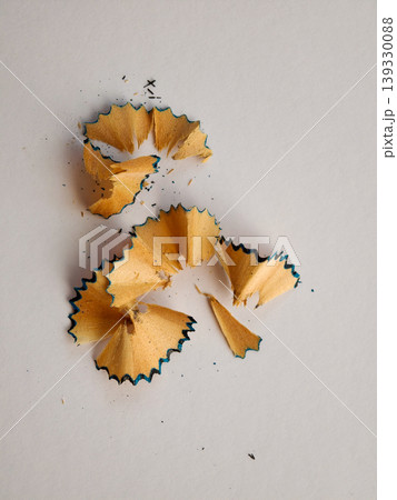 Wooden pencil shavings with blue lead debris 139330088