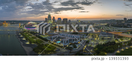 Cincinnati Ohio urban architecture in city downtown at night. Panoramic view of business district skyline with high-rise buildings at nightfall Cincinnati Ohio urban architecture in city downtown at night. Panoramic view of business district skyline with high-rise buildings at nightfall 139331393