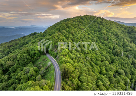 Blue Ridge Parkway road in summer woods of Appalachian mountains at sunset. Road trip driving in wild nature in summertime season Blue Ridge Parkway road in summer woods of Appalachian mountains at sunset. Road trip driving in wild nature in summertime season 139331459
