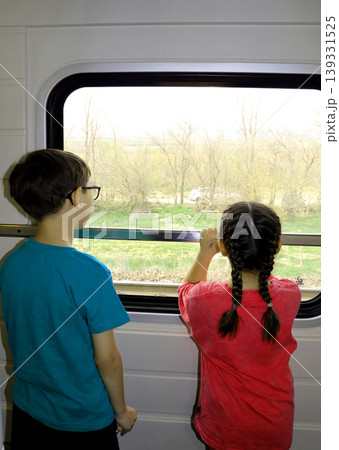 children on train station platform and traveling children on train station platform and traveling 139331525