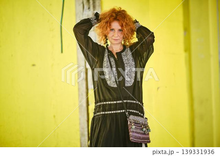 Red haired woman with stylish handbag lifestyle portrait Red haired woman with stylish handbag lifestyle portrait 139331936