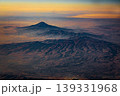 Aerial view of mountain landscape at sunset from airplane window 139331968