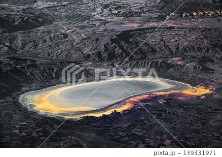 Aerial view of salt lake and surrounding landscape with abstract colors Aerial view of salt lake and surrounding landscape with abstract colors 139331971