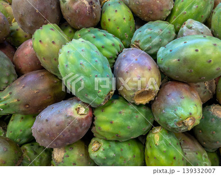 Fresh prickly pears pile at farmers market, cactus fruit harvest display Fresh prickly pears pile at farmers market, cactus fruit harvest display 139332007