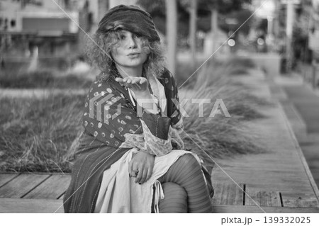 young woman sitting on bench young woman sitting on bench 139332025