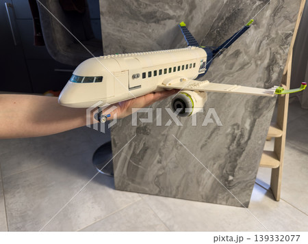Airplane constructor, a plastic model of a passenger plane for children's games and creative construction Airplane constructor, a plastic model of a passenger plane for children's games and creative construction 139332077