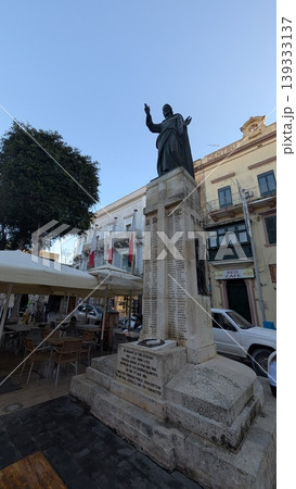 A square with a monument in touristy area of Gozo island A square with a monument in touristy area of Gozo island 139333137