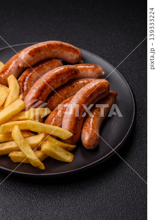 Grilled or barbecued chicken sausages for the dinner table. Grilled sausages Grilled or barbecued chicken sausages for the dinner table. Grilled sausages 139333224