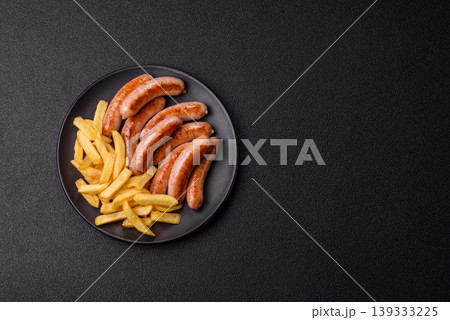 Grilled or barbecued chicken sausages for the dinner table. Grilled sausages Grilled or barbecued chicken sausages for the dinner table. Grilled sausages 139333225