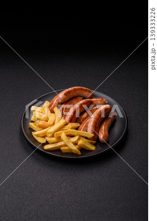 Grilled or barbecued chicken sausages for the dinner table. Grilled sausages Grilled or barbecued chicken sausages for the dinner table. Grilled sausages 139333226