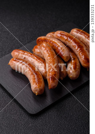 Grilled or barbecued chicken sausages for the dinner table. Grilled sausages Grilled or barbecued chicken sausages for the dinner table. Grilled sausages 139333231