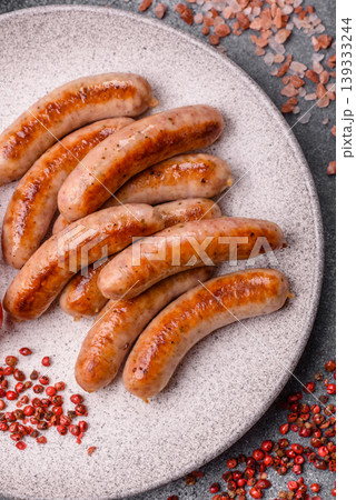 Grilled or barbecued chicken sausages for the dinner table. Grilled sausages 139333244