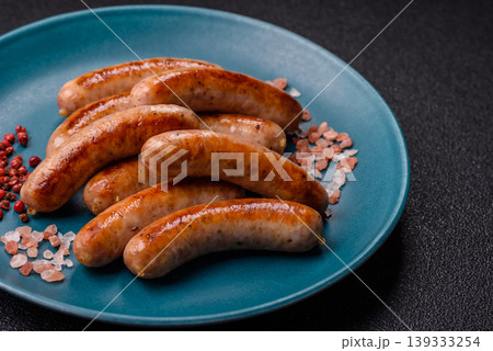 Grilled or barbecued chicken sausages for the dinner table. Grilled sausages Grilled or barbecued chicken sausages for the dinner table. Grilled sausages 139333254