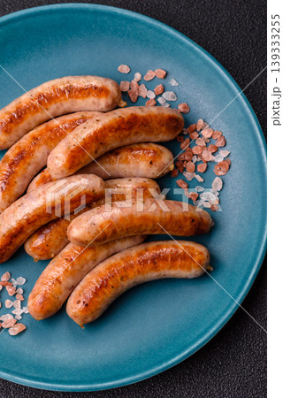Grilled or barbecued chicken sausages for the dinner table. Grilled sausages Grilled or barbecued chicken sausages for the dinner table. Grilled sausages 139333255