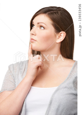 Face, vision and future with a woman and thinking in studio isolated on white background for planning. Plus size, problem solving and brainstorming with a young body positive model looking thoughtful 139333456