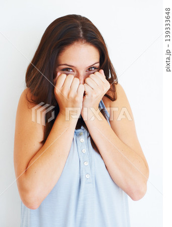 Excited, hiding and portrait of shy woman with playful energy in white background of studio. Happy, emoji and person with hands to cover face for gossip story, information or reaction to drama Excited, hiding and portrait of shy woman with playful energy in white background of studio. Happy, emoji and person with hands to cover face for gossip story, information or reaction to drama 139333648
