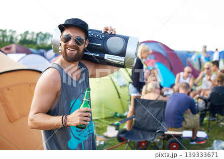 Music festival, alcohol and man with boombox outdoors for social party, celebration and camp event. Happy, excited and person with beer or beverage at musical concert for freedom, vacation and radio Music festival, alcohol and man with boombox outdoors for social party, celebration and camp event. Happy, excited and person with beer or beverage at musical concert for freedom, vacation and radio 139333671
