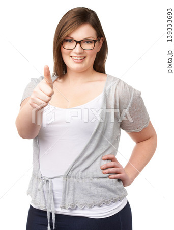 Glasses, portrait and plus size model with thumbs up, smile and casual fashion on white background. Self love, body positivity and happy woman with agreement, thank you or yes hand gesture in studio. Glasses, portrait and plus size model with thumbs up, smile and casual fashion on white background. Self love, body positivity and happy woman with agreement, thank you or yes hand gesture in studio. 139333693